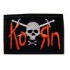 Korn logo rosu cu craniu alb si