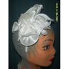 White rose fascinator on her head